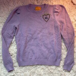 purple Le Lion sweater with embroidery and pearl detail on chest